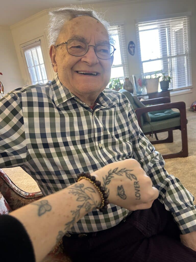 Happy elderly man smiling warmly while receiving personalized private home care support at home in Kansas City—illustrating meaningful human moments and extended healthspan beyond basic daily assistance.